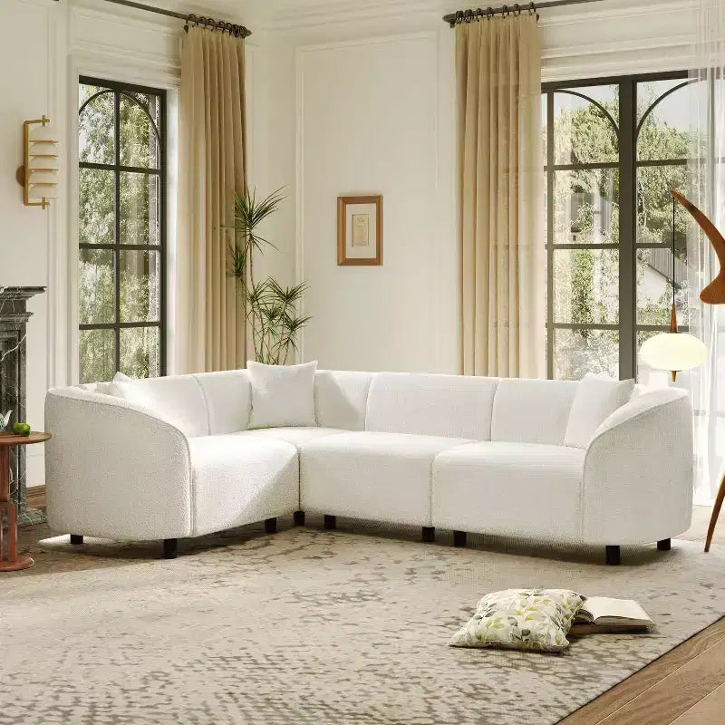 Canapé d'angle incurvé en U de 264 cm, avec revêtement bouclé de qualité supérieure et design sculptural de luxe à quatre places pour un salon spacieux.